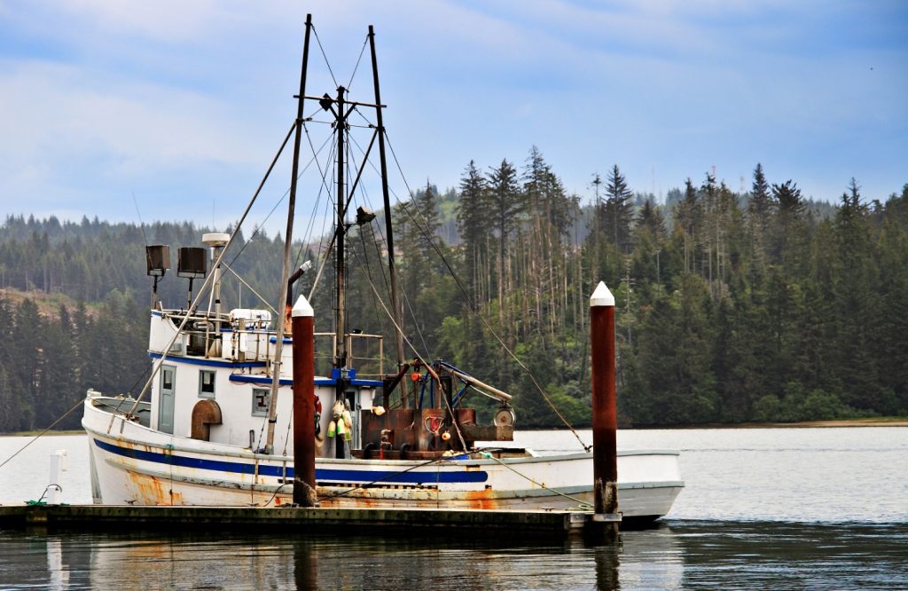 A fishing boat docked in harbor in Oregon | Fishing on the Oregon Coast