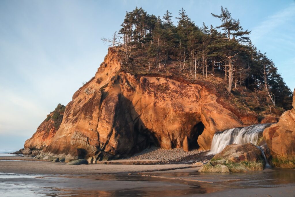 Hug Point waterfall State Park waterfall and cliff, Oregon Coast